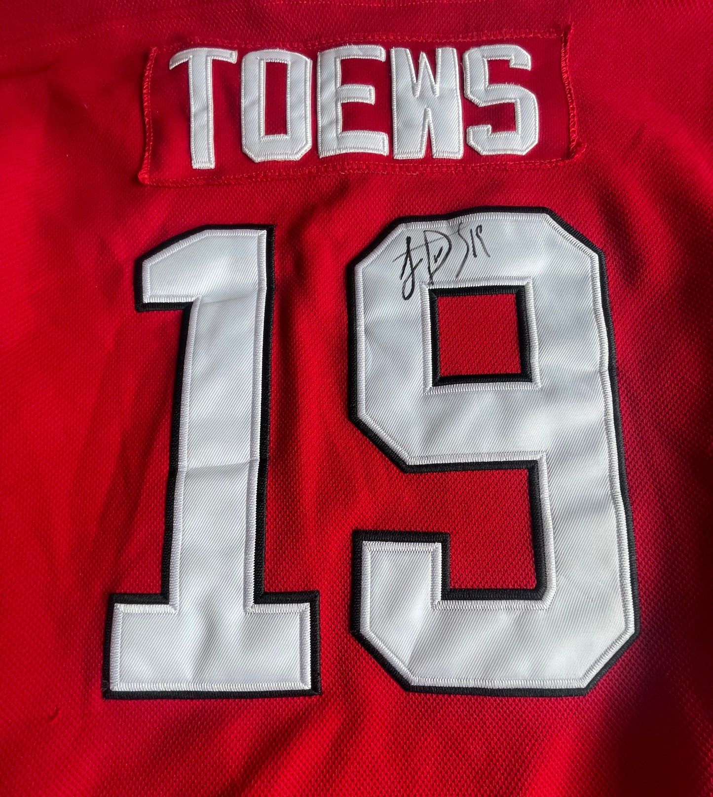 Johnathan Toews Autographed Jersey