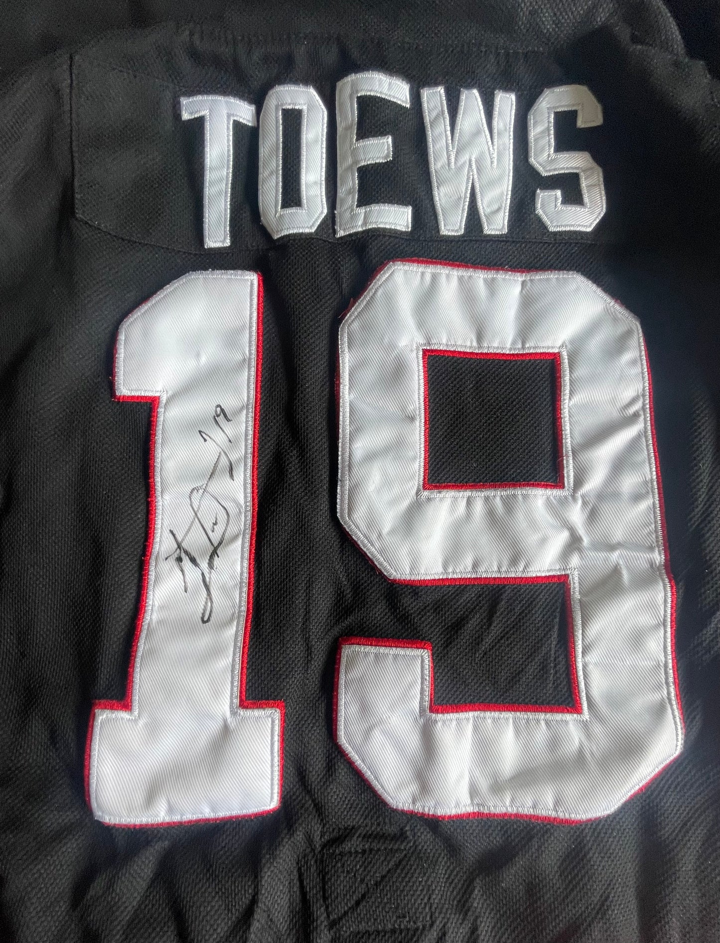 Johnathan Toews Autographed Jersey