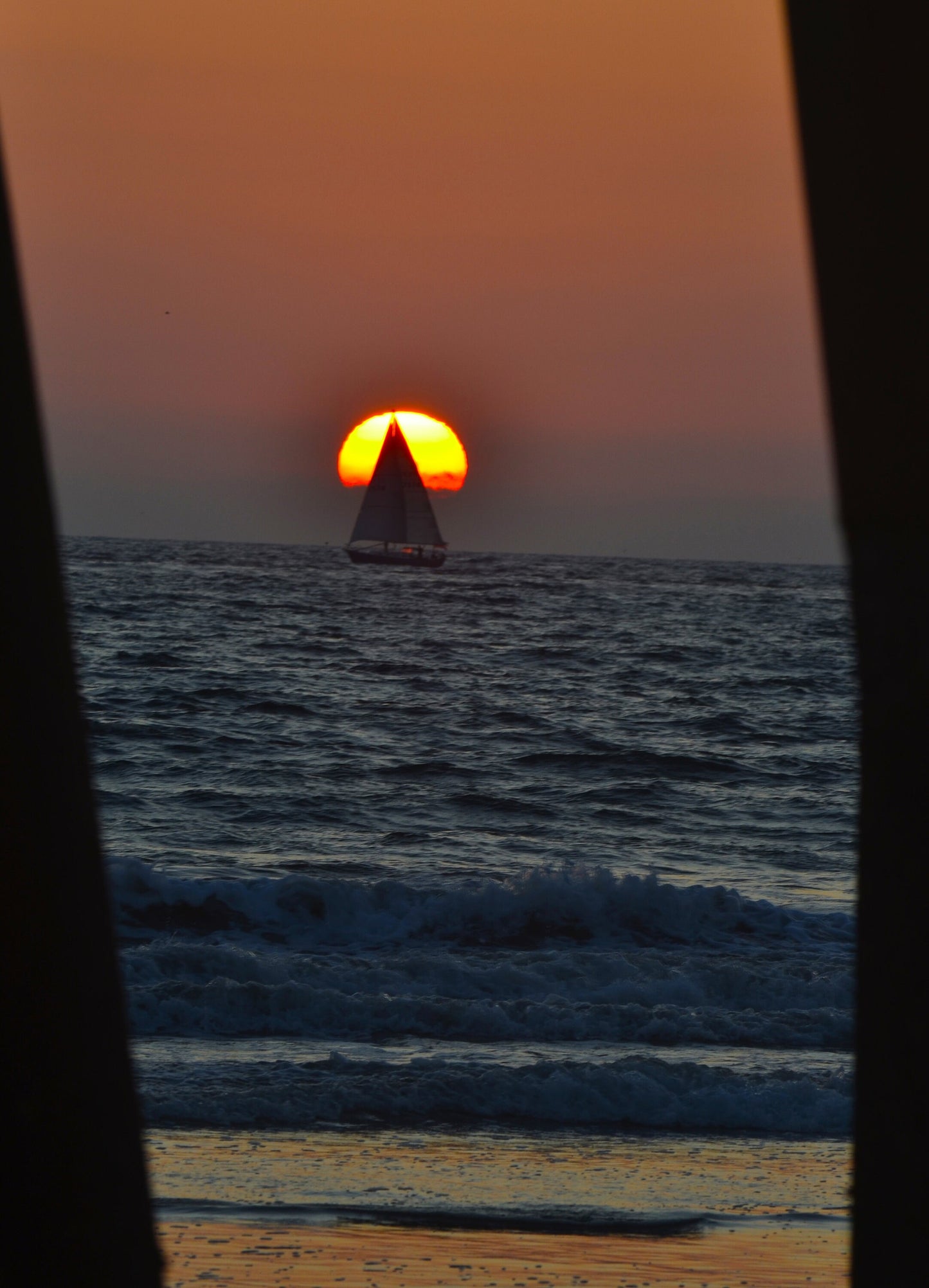 Sailboat Crosses the Sun